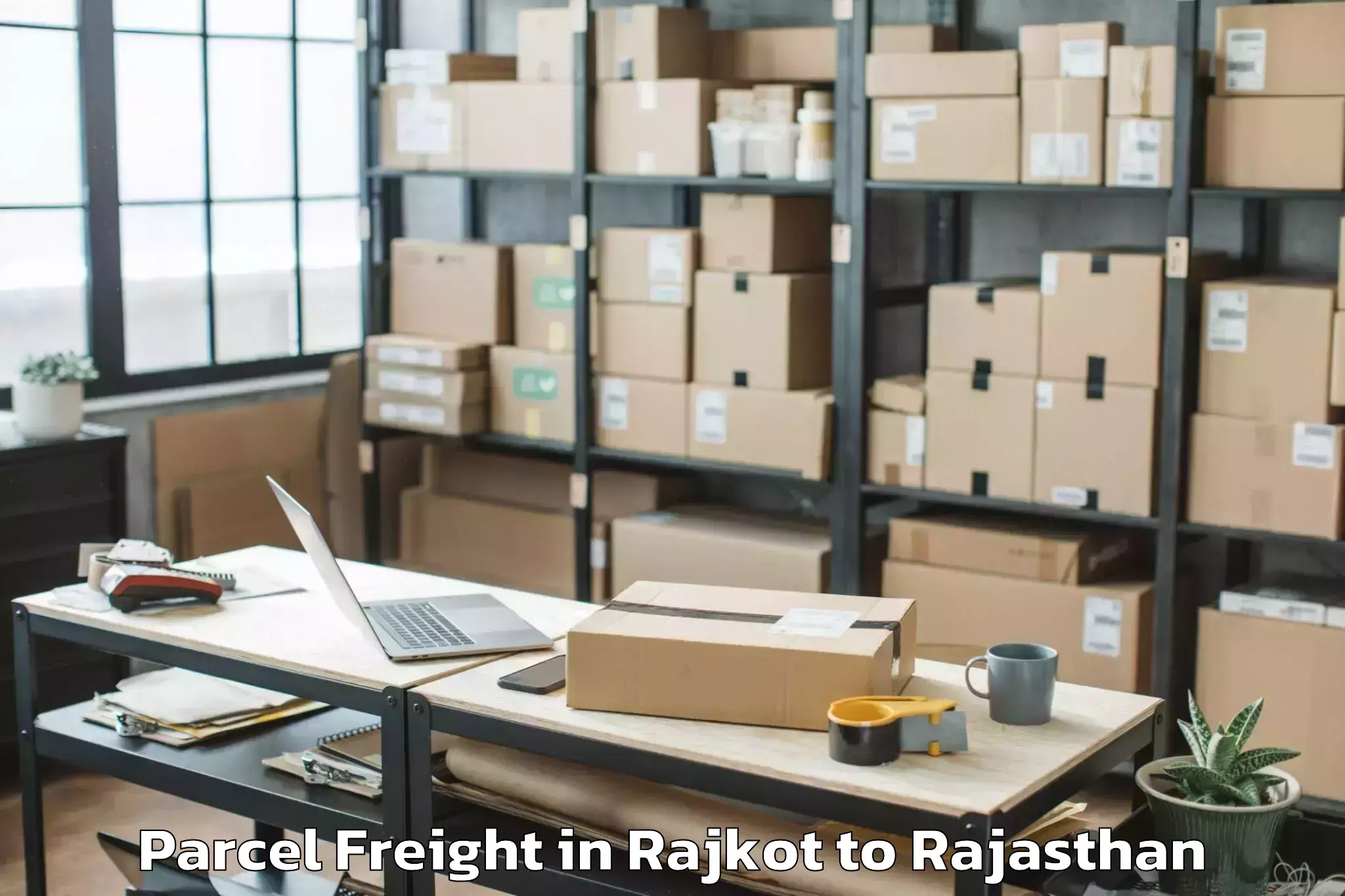 Leading Rajkot to Raisinghnagar Parcel Freight Provider